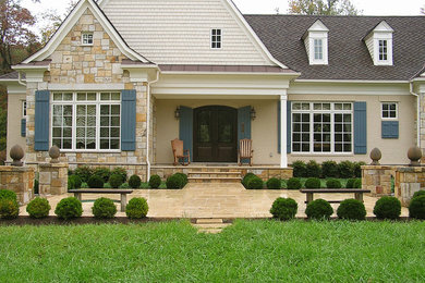 Inspiration for a large timeless beige one-story mixed siding exterior home remodel in DC Metro