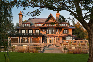 Example of a large ornate three-story mixed siding exterior home design in Boston