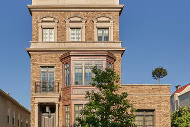 Transitional three-story brick townhouse exterior idea in Chicago