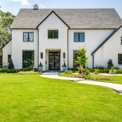 Transitional white two-story exterior home photo in Dallas with a shingle roof