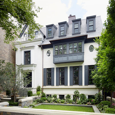 Inspiration for a timeless white three-story gable roof remodel in Chicago
