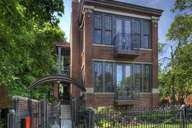 This is an example of a large and multi-coloured traditional brick detached house in Chicago with a flat roof, a mixed material roof and three floors.