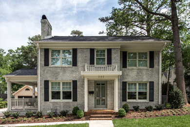 Mid-sized transitional white two-story brick gable roof idea in Charlotte with a shingle roof