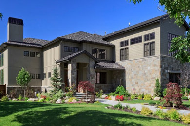 Inspiration for a large rustic gray two-story mixed siding exterior home remodel in Denver