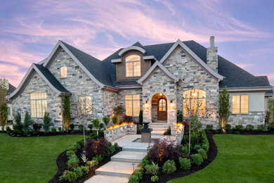 Transitional gray three-story stone exterior home photo in Salt Lake City