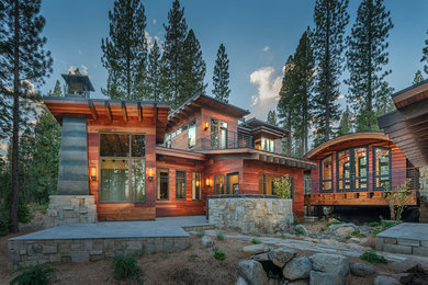 Large minimalist brown two-story wood flat roof photo in Sacramento