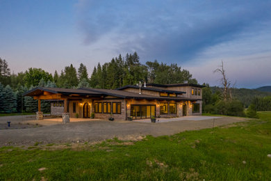 Large mediterranean two-story house exterior idea in Seattle with a shingle roof