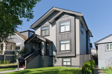 Mid-sized arts and crafts gray three-story wood exterior home photo in Vancouver with a shingle roof