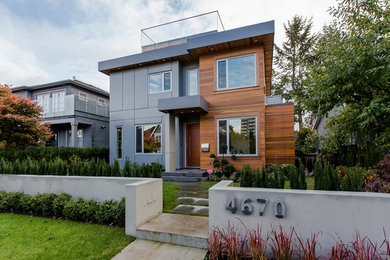 Example of a trendy multicolored two-story mixed siding exterior home design in Vancouver