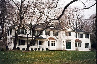 Large traditional white three-story wood exterior home idea in New York with a shingle roof