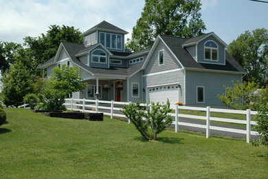 Inspiration for a large timeless gray two-story wood exterior home remodel in DC Metro with a shingle roof