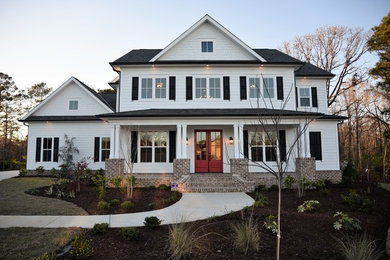 Example of a country exterior home design in Other