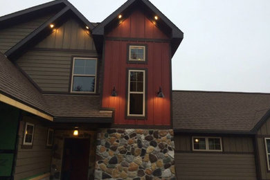 Inspiration for a large craftsman two-story mixed siding gable roof remodel in Chicago