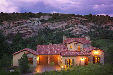 Large mediterranean beige one-story mixed siding exterior home idea in Denver