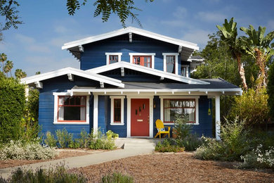 Example of a beach style blue two-story gable roof design in Los Angeles