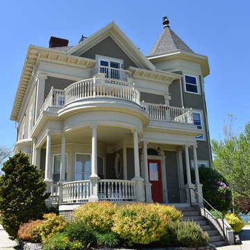 Victorian Home Exterior with Balcony, Porch and Red Door