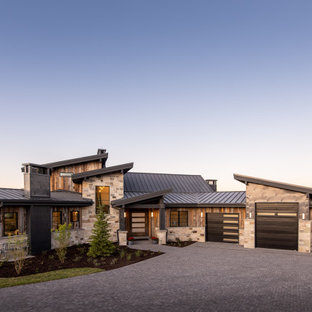 Example of a large trendy brown two-story mixed siding house exterior design in Salt Lake City with a shed roof and a metal roof