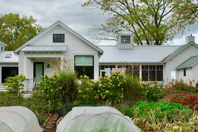 Farmhouse white one-story concrete fiberboard exterior home idea in Chicago with a metal roof