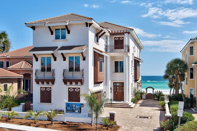Photo of a beach style house exterior in Miami.