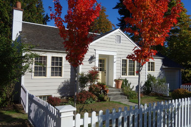 Example of a small beach style gray one-story wood exterior home design in Seattle with a shingle roof
