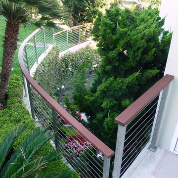 View of Ipe cable railing along sloped walkway