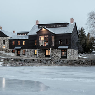 Vintage barn frame addition to Dutch stone house