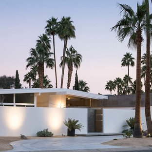 Inspiration for a mid-sized 1960s white one-story stucco gable roof remodel in Los Angeles