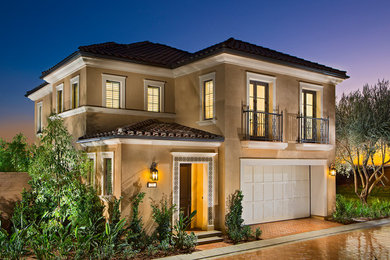 Example of a two-story exterior home design in Orange County