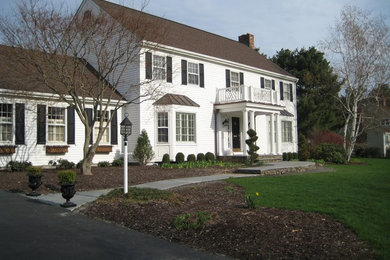 Inspiration for a timeless white two-story exterior home remodel in New York