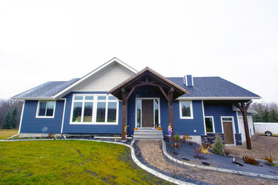 Example of a mid-sized minimalist blue two-story vinyl house exterior design with a shingle roof