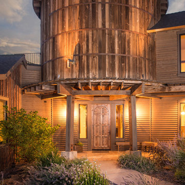 Water tower inspired home inside front gate at dusk 2