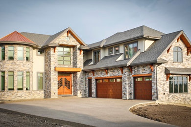 Traditional two floor house exterior in Calgary with mixed cladding.