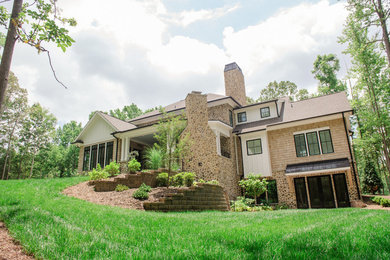Huge country three-story wood exterior home photo in Charlotte