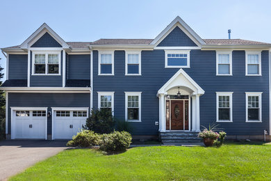 Inspiration for a large timeless blue two-story concrete fiberboard exterior home remodel in New York