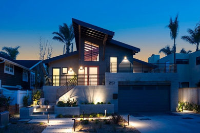 Mid-sized contemporary gray two-story mixed siding house exterior idea in San Diego with a shed roof and a shingle roof