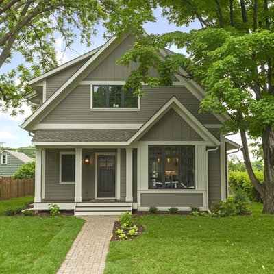 Example of a mid-sized classic gray two-story vinyl exterior home design in Minneapolis