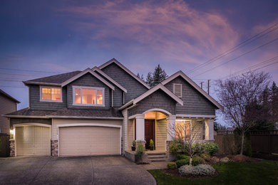 Inspiration for a timeless gray two-story mixed siding house exterior remodel in Seattle with a shingle roof