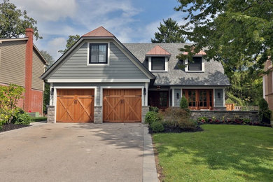 Craftsman gray two-story mixed siding house exterior idea in Other with a clipped gable roof and a shingle roof