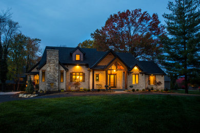 Inspiration for a large rustic beige one-story wood exterior home remodel in Cincinnati with a shingle roof