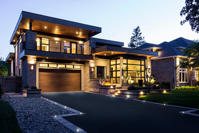 Inspiration for a large contemporary two-story exterior home remodel in Toronto
