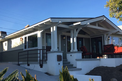 Inspiration for a mid-sized craftsman gray one-story wood gable roof remodel in Orange County