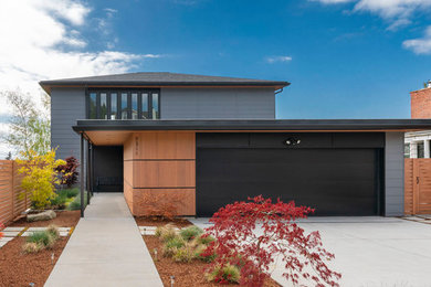 Mid-sized minimalist gray three-story mixed siding house exterior photo in Seattle with a hip roof and a shingle roof