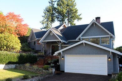 Inspiration for a timeless gray two-story wood exterior home remodel in Vancouver