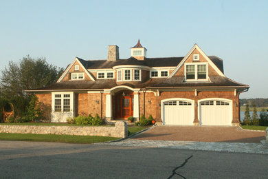 Example of a two-story wood exterior home design in Bridgeport