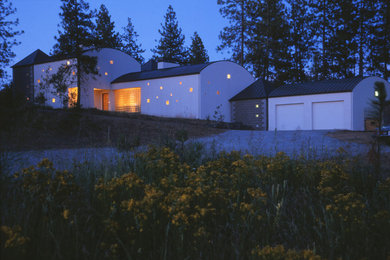 Inspiration for a contemporary white two-story exterior home remodel in Seattle