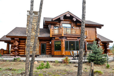Example of a large mountain style brown split-level mixed siding exterior home design in Denver with a shingle roof