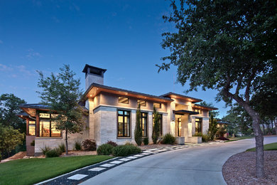 Trendy gray one-story exterior home photo in Austin with a hip roof