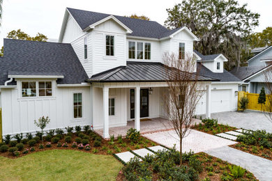 Inspiration for a large country white two-story house exterior remodel in Orlando