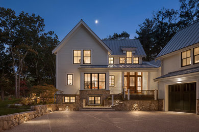 Inspiration for a mid-sized country two-story wood exterior home remodel in Boston with a metal roof