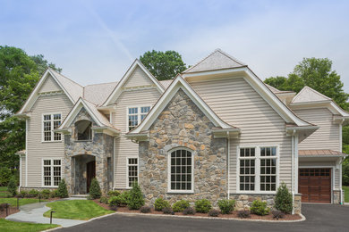 Huge transitional beige two-story wood exterior home photo in New York